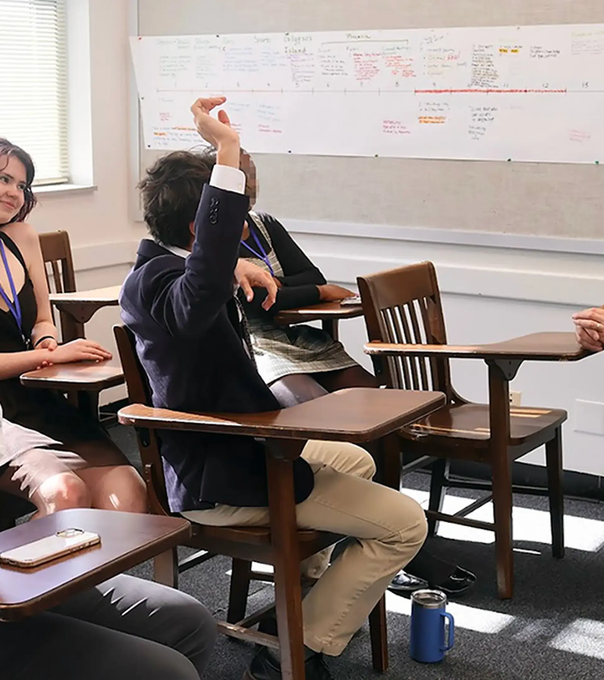 Students and a teacher debate respectfully in a TJ English class.