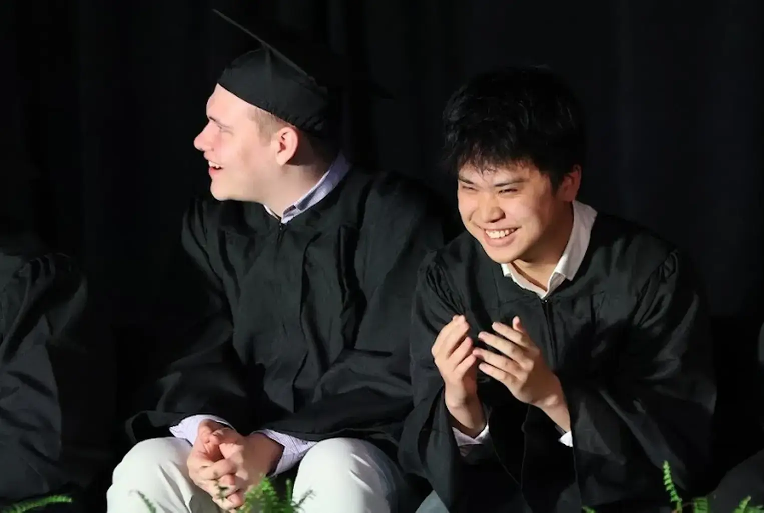 Graduates laughing together