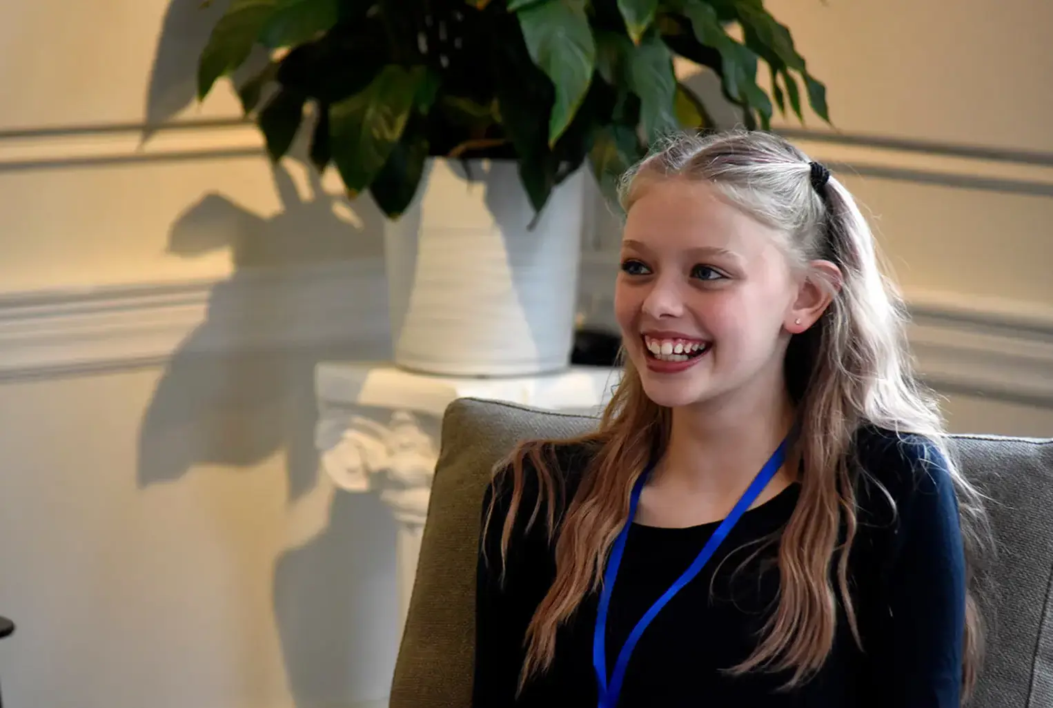 Smiling student wearing lanyard